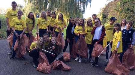 The Community Ambassadors pictured on a litter pick in a park.